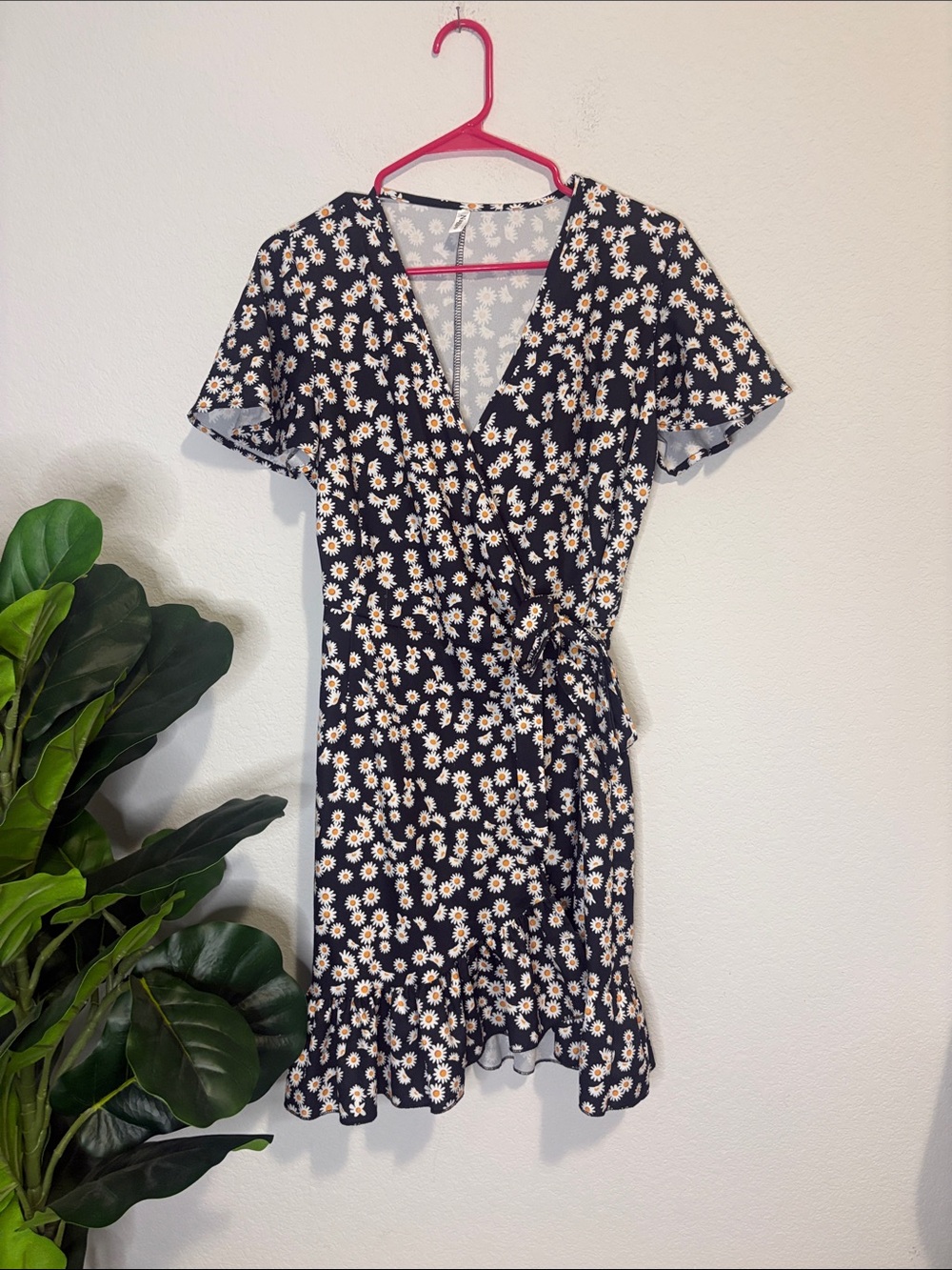 Black Daisy Wrap Dress with Ruffle Hem and flutter sleeves Medium